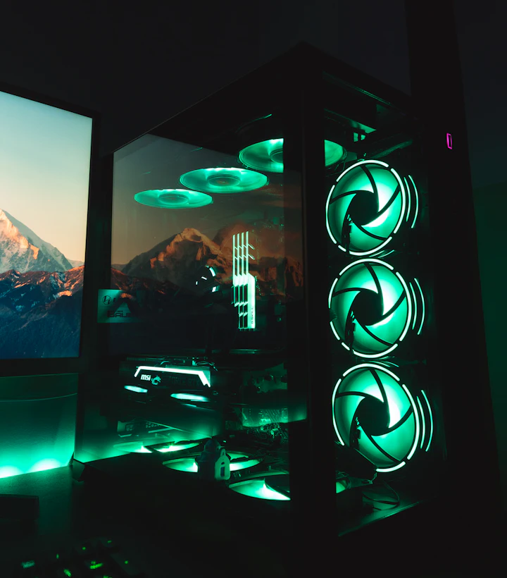 Glass-panelled gaming PC with green fan lighting