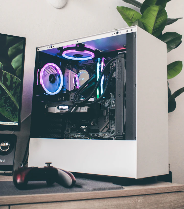 White gaming PC with glass side panel and purple RGB lighting